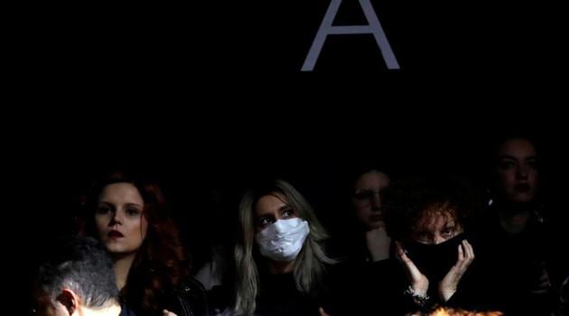 FILE PHOTO: A person in the audience wears a mask as she attends the Dolce & Gabbana Autumn/Winter 2020 collection show during Milan Fashion Week in Milan, Italy, February 23, 2020.(REUTERS)