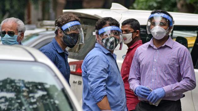 Mumbaikar wearing a face shield and mask as a preventive measure to Covid-19 at Ballard Pier, in Mumbai.(ANI)