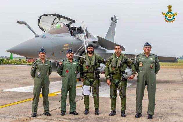 Chief of the Air Staff, Air Chief Marshal RKS Bhadauria (2nd L) and Air Officer Commanding-in-Chief Western Air Command, Air Marshal B Suresh (R) along with the IAF pilots of the first five Rafale combat aircraft after arriving from France at the Air Force Station, in Ambala. (PTI photo)