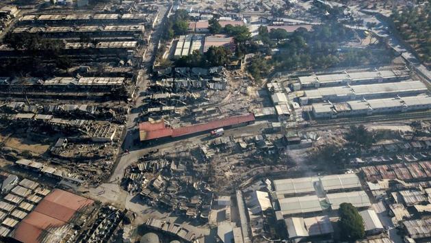 A view of the gutted Moria camp on September 10 in Lesbos. A fire late on September 8 in the camp, which is Greece’s most notoriously overcrowded migrant facility, had sent thousands fleeing for safety into surrounding olive groves. While nobody was seriously hurt, the blaze destroyed the official part of the camp, which housed 4,000 people, AFP reported. (AFP) A view of the gutted Moria camp on September 10 in Lesbos. A fire late on September 8 in the camp, which is Greece’s most notoriously overcrowded migrant facility, had sent thousands fleeing for safety into surrounding olive groves. While nobody was seriously hurt, the blaze destroyed the official part of the camp, which housed 4,000 people, AFP reported. (AFP)