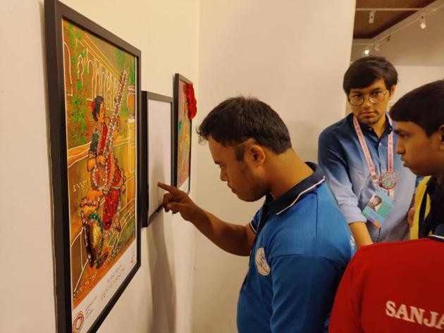 A differently abled student reads Braille art and signage at the Serendipity Arts festival in Goa in 2019. A differently abled student reads Braille art and signage at the Serendipity Arts festival in Goa in 2019.