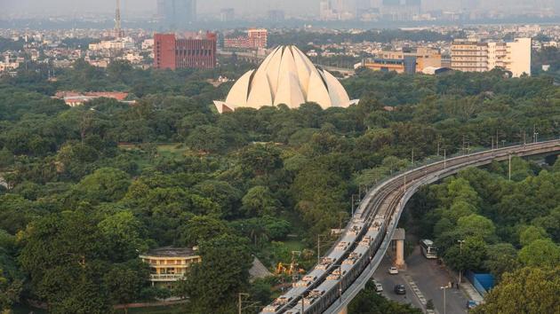 Metro train running near Lotus Temple in New Delhi. (Amal KS/HT PHOTO) Metro train running near Lotus Temple in New Delhi. (Amal KS/HT PHOTO)