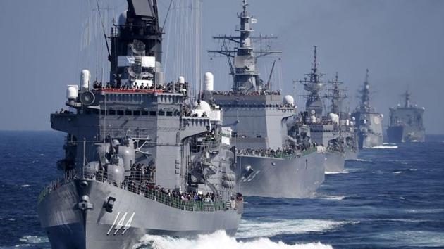 Japan Maritime Self-Defense Force (JMSDF) destroyer Kurama (L), which is carrying Japan's Prime Minister Shinzo Abe, leads the JMSDF fleet during its fleet review at Sagami Bay, off Yokosuka, south of Tokyo.(REUTERS) Japan Maritime Self-Defense Force (JMSDF) destroyer Kurama (L), which is carrying Japan's Prime Minister Shinzo Abe, leads the JMSDF fleet during its fleet review at Sagami Bay, off Yokosuka, south of Tokyo.(REUTERS)