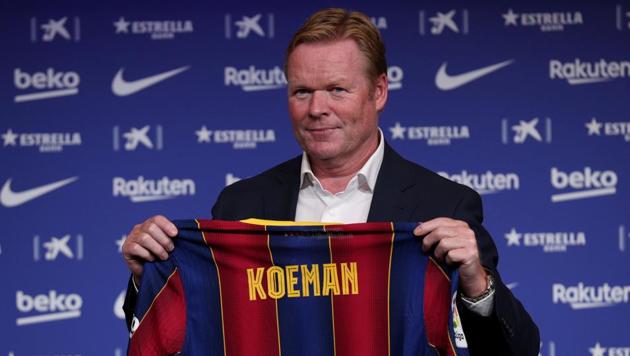 Barcelona coach Ronald Koeman poses with a Barcelona shirt during the unveiling(REUTERS) Barcelona coach Ronald Koeman poses with a Barcelona shirt during the unveiling(REUTERS)