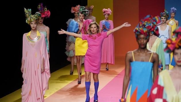 Spanish designer Agatha Ruiz de la Prada appears at the end of her collection show during the Mercedes Benz Fashion Week, amid the coronavirus disease (COVID-19) outbreak, in Madrid, Spain, September 10, 2020. (REUTERS)