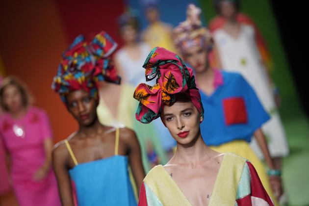 Models present creations by Spanish designer Agatha Ruiz de la Prada during the Mercedes Benz Fashion Week, amid the coronavirus disease (COVID-19) outbreak, in Madrid, Spain, September 10, 2020.  (REUTERS) 