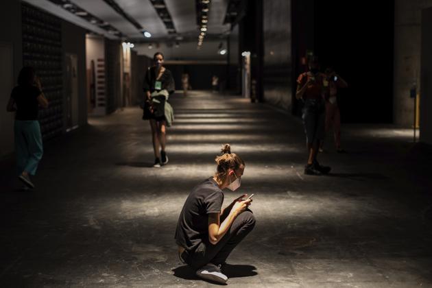 A model waits at the backstage of the Mercedes-Benz Fashion Week in Madrid, Spain, Wednesday, Sept. 9, 2020. (AP) 