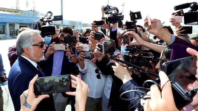 Abdullah Abdullah, Chairman of the High Council for National Reconciliation, talks with the media at Kabul International Airport in Kabul, Afghanistan.(AP)