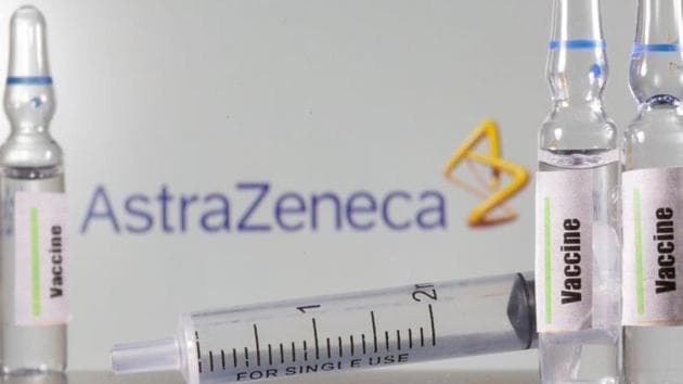 A test tube labelled with the Vaccine is seen in front of AstraZeneca logo.(REUTERS)