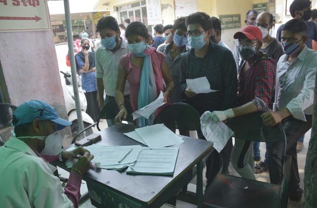 People wait their turn to register for coronavirus testing, at MMG Hospital, in Ghaziabad, India, on Friday, September 11, 2020.(Sakib Ali /Hindustan Times)