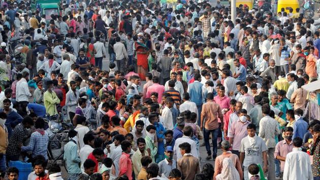 Daily wagers and migrant labourers gather alongside a road as they wait for work in Ahmedabad on September 10. “Males, living in urban slums and occupation with high risk of exposure to potentially infected persons were associated with seropositivity. A cumulative 6,468,388… adult infections were estimated in India by the early May,” said the findings published in the Indian Journal of Medical Research (IJMR). (Amit Dave / REUTERS) Daily wagers and migrant labourers gather alongside a road as they wait for work in Ahmedabad on September 10. “Males, living in urban slums and occupation with high risk of exposure to potentially infected persons were associated with seropositivity. A cumulative 6,468,388… adult infections were estimated in India by the early May,” said the findings published in the Indian Journal of Medical Research (IJMR). (Amit Dave / REUTERS)