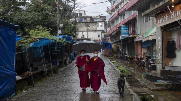 Tibetan Buddhist monks wearing face masks walk in a deserted market area in Dharamshala on September 11. “That has always been the concern that testing was not adequate as India was largely testing symptomatic cases and asymptomatic positives is a huge number that may have been missed,” said Dr Lalit Kant, former head, epidemiology and communicable diseases, ICMR. (Ashwini Bhatia / AP) Tibetan Buddhist monks wearing face masks walk in a deserted market area in Dharamshala on September 11. “That has always been the concern that testing was not adequate as India was largely testing symptomatic cases and asymptomatic positives is a huge number that may have been missed,” said Dr Lalit Kant, former head, epidemiology and communicable diseases, ICMR. (Ashwini Bhatia / AP)