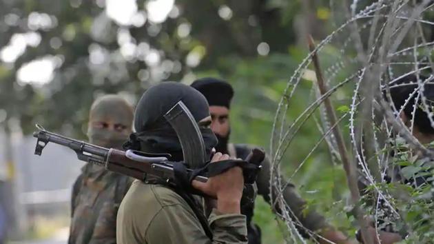 Policeman stand guard during a search operation in Srinagar.(HT File Photo) Policeman stand guard during a search operation in Srinagar.(HT File Photo)