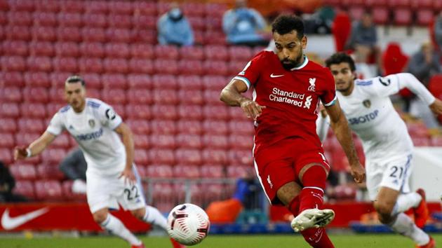 Liverpool's Mohamed Salah scores his side's fourth goal on a penalty kick during the English Premier League soccer match between Liverpool and Leeds United, at the Anfield stadium, in Liverpool, Saturday, Sept. 12, 2020. (Phil Noble, Pool via AP)(AP)