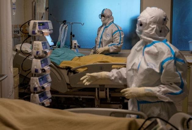 Medical workers take care of patients suffering from the coronavirus disease (Covid-19), at the Intensive Care Unit (ICU) of the Max Smart Super Speciality Hospital in New Delhi. (REUTERS) Medical workers take care of patients suffering from the coronavirus disease (Covid-19), at the Intensive Care Unit (ICU) of the Max Smart Super Speciality Hospital in New Delhi. (REUTERS)