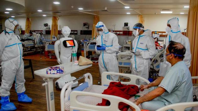 A Covid-19 patient before interacting with family members via a robot, at a Noida hospital on September 12.(PTI)