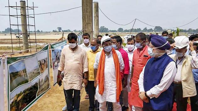 Union Civil Aviation Minister Hardeep Singh Puri along with other officials during review work of a newly constructed domestic airport, in Deoghar district Saturday.(PTI) Union Civil Aviation Minister Hardeep Singh Puri along with other officials during review work of a newly constructed domestic airport, in Deoghar district Saturday.(PTI)