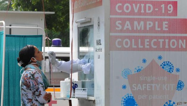 A woman’s sample being collected for Covid testing in Chandigarh on Monday. (Keshav Singh/HT) A woman’s sample being collected for Covid testing in Chandigarh on Monday. (Keshav Singh/HT)