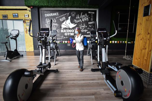 A worker disinfects the premises of a gym in Delhi’s Shalimar Bagh.(Sanchit Khanna/HT PHOTO (For representational purposes only))