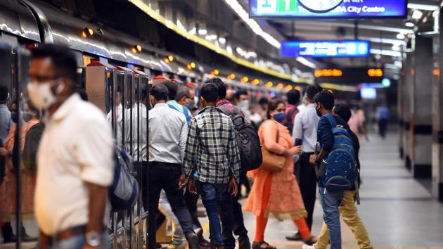 Passengers wear masks while using metro services during Unlock 4, at Rajiv Chowk metro station, in New Delhi.(Raj K Raj/HT PHOTO)