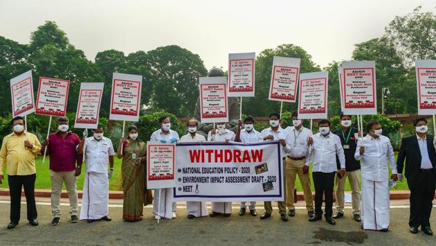 Dravida Munnetra Kazhagam (DMK) party members hold placards during a protest over various issues outside Parliament House in New Delhi on September 14. Parliamentarians from Congress, Nationalist Congress Party (NCP) and DMK raised concerns over several issues like unemployment, NEET exams and National Education Policy which did not make it to the discussions during the session proceedings, HT reported. (PTI)