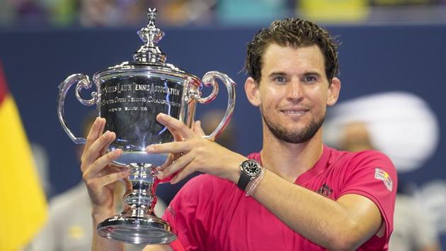 New York: Dominic Thiem, of Austria, holds up the championship trophy after defeating Alexander Zverev, of Germany, in the men's singles final of the US Open tennis championships, Sunday, Sept. 13, 2020, in New York.AP/PTI(AP14-09-2020_000010A)(AP)