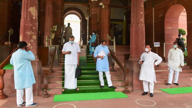 Members of Parliament follow social distancing guidelines at Parliament House on the opening day of monsoon session in New Delhi on September 14. Arrangements were made at the Parliament for the session to proceed in a safe manner. All members wore face masks as a precautionary measure against coronavirus. (Kamal Kishore / PTI)