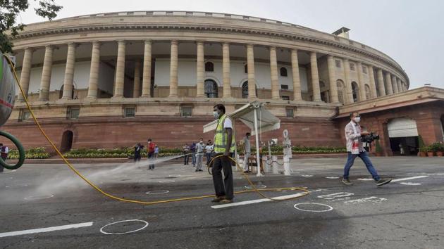 Sanitization work underway at Parliament House in New Delhi on September 14. Twenty-four Lok Sabha members tested positive for coronavirus on the first day of the monsoon session. Junior railways minister Suresh Angadi, BJP’s Meenakshi Lekhi, Anant Kumar Hegde, Parvesh Sahib Singh, Rita Bahuguna Joshi and Kaushal Kishore were among MPs who have contracted the virus, secretariat officials told HT. (Kamal Singh / PTI)