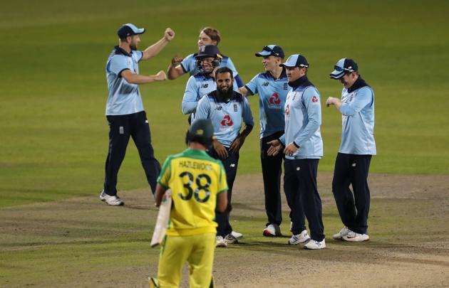 Cricket - Second One Day International - England v Australia - Emirates Old Trafford, Manchester - September 13, 2020 England players celebrate winning the match after the wicket of Australia's Alex Carey Pool via REUTERS/Martin Rickett (Pool via REUTERS)