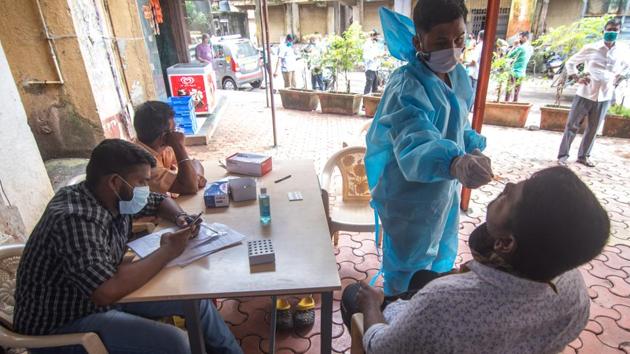 Health care worker during Covid-19 antigen test at Mankhurd in Mumbai. (Photo By Pratik Chorge/Hindustan Times)