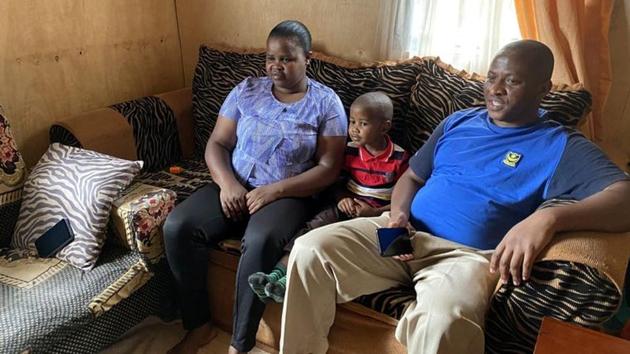 Five-year-old Miguel Munene sits between his parents Patrick Nyaga and Celestine Wanjiru, as he watches characters from a cartoon made by Tanzanian non-profit Ubongo, which offers television and radio content for free to African broadcasters in Nairobi, Kenya August 29, 2020.(via REUTERS)