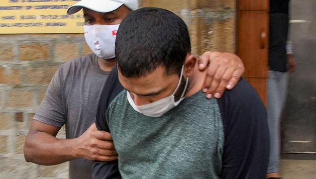 Alleged drug peddler Chris Costa being taken by NCB officers for a medical examination, in Mumbai on Tuesday.(PTI)