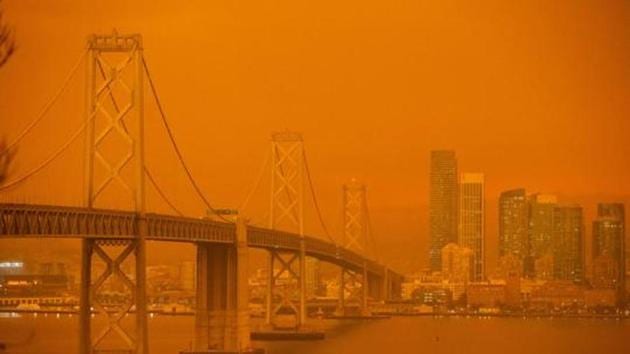 The San Francisco Bay Bridge and city skyline are obscured in orange smoke and haze as their seen from Treasure Island in San Francisco, California, September 9, 2020. More than 300,000 acres are burning across the northwestern state including 35 major wildfires, with at least five towns "substantially destroyed" and mass evacuations taking place(AFP) The San Francisco Bay Bridge and city skyline are obscured in orange smoke and haze as their seen from Treasure Island in San Francisco, California, September 9, 2020. More than 300,000 acres are burning across the northwestern state including 35 major wildfires, with at least five towns "substantially destroyed" and mass evacuations taking place(AFP)