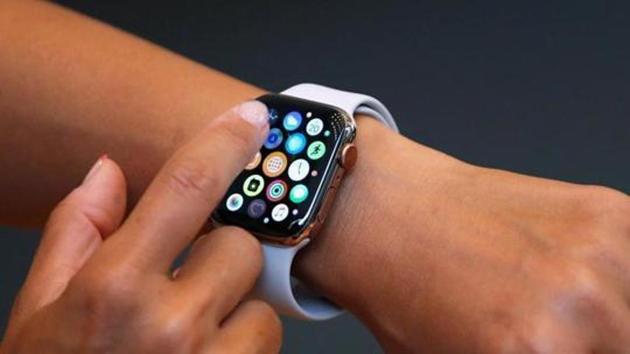 A customer checks Apple's new Apple Watch Series 4 after it went on sale at the Apple Store in Tokyo's Omotesando shopping district in Japan.(Reuters Photo) A customer checks Apple's new Apple Watch Series 4 after it went on sale at the Apple Store in Tokyo's Omotesando shopping district in Japan.(Reuters Photo)