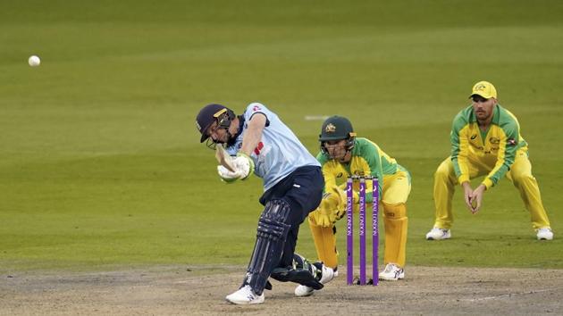 England's Jos Buttler left, hits a shot.(AP)