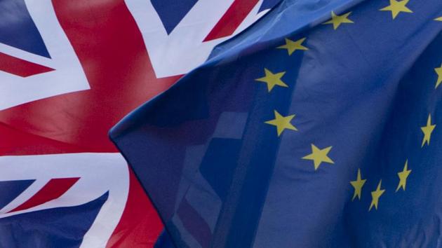 FILE - In this Friday, Dec. 8, 2017 file photo, the British and EU flags flap in the wind outside EU headquarters in Brussels. The U.K. indicated Tuesday, Sept. 8, 2020, that it was prepared to break an international agreement as post-Brexit trade discussions with the European Union resumed on an increasingly acrimonious tone. (AP Photo/Virginia Mayo, File) (AP file photo) FILE - In this Friday, Dec. 8, 2017 file photo, the British and EU flags flap in the wind outside EU headquarters in Brussels. The U.K. indicated Tuesday, Sept. 8, 2020, that it was prepared to break an international agreement as post-Brexit trade discussions with the European Union resumed on an increasingly acrimonious tone. (AP Photo/Virginia Mayo, File) (AP file photo)