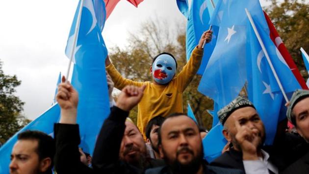 A masked Uighur boy takes part in a protest against China, at the courtyard of Fatih Mosque in Istanbul, Turkey in 2018.(Reuters file) A masked Uighur boy takes part in a protest against China, at the courtyard of Fatih Mosque in Istanbul, Turkey in 2018.(Reuters file)
