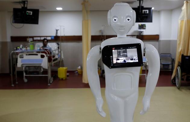 A robot named 'Mitra', which is used by the patients suffering from the coronavirus disease (COVID-19) to communicate with their relatives, is seen inside an Intensive Care Unit (ICU) of the Yatharth Super Speciality Hospital in Noida, on the outskirts of New Delhi, India, September 15, 2020. (REUTERS)