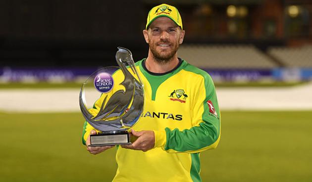 Aaron Finch with the winner’s trophy after Australia beat England by three wickets in the final ODI in Manchester and secured a 2-1 series win (getty)