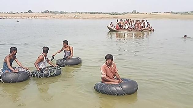 Rescue teams carry out search operations for missing people after a boat sank while crossing Chambal River. (PTI Photo) Rescue teams carry out search operations for missing people after a boat sank while crossing Chambal River. (PTI Photo)