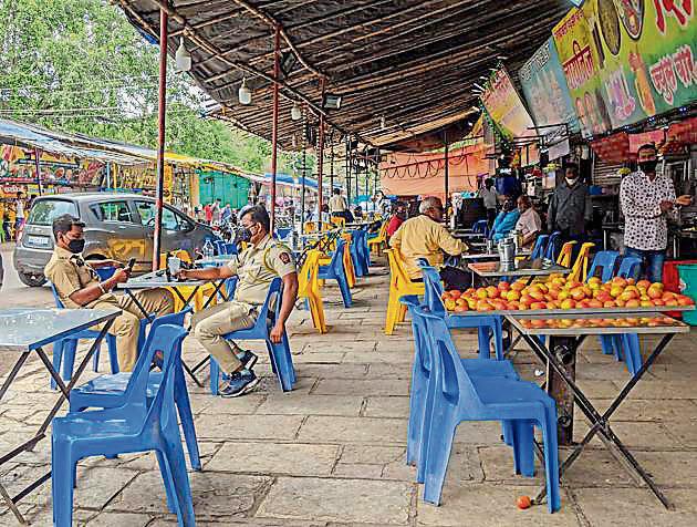 Police officials seen at a hotel in Sarasbaug in Pune on Thursday. (Sanket Wankhade/HT PHOTO) Police officials seen at a hotel in Sarasbaug in Pune on Thursday. (Sanket Wankhade/HT PHOTO)