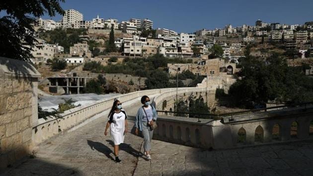 Young Palestinian travel bloggers Malak Hasan and Bisan Alhajhasan arrive at the Convent of the Hortus Conclusus in Artas village near Bethlehem in the Israeli-occupied West Bank September 9, 2020.(REUTERS)