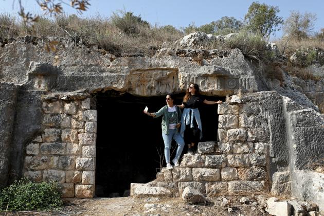 Malak Hasan and Bisan Alhajhasan take a selfie at the remains of an archeological site in the village of Aboud near Ramallah in the Israeli-occupied West Bank September 15, 2020. (REUTERS)