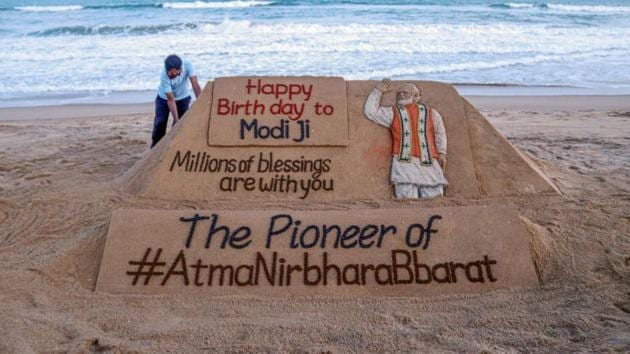 Sand artist Sudarsan Pattnaik gives finishing touches to a sand sculpture dedicated to PM Narendra Modi, ahead of his birthday on September 17. (PTI) Sand artist Sudarsan Pattnaik gives finishing touches to a sand sculpture dedicated to PM Narendra Modi, ahead of his birthday on September 17. (PTI)