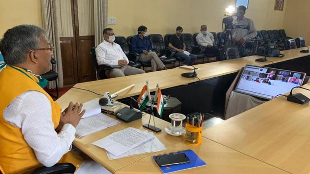 Chief minister TS Rawat addressing a press conference virtually in Dehradun on Friday. He said the Mahakumbh would be held on schedule next year, but in a restricted manner.(Sourced)