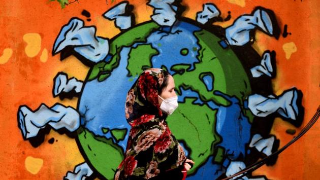 A woman wearing a face mask walks past a Covid-19 graffiti at Bandra in Mumbai on September 17. India’s current Covid-19 tally stands at 1,017,754 active cases and 84,372 deaths. (Satish Bate / HT Photo) A woman wearing a face mask walks past a Covid-19 graffiti at Bandra in Mumbai on September 17. India’s current Covid-19 tally stands at 1,017,754 active cases and 84,372 deaths. (Satish Bate / HT Photo)