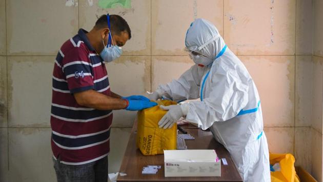 Medical professionals preserve swab samples collected for Covid-19 test in Saket, New Delhi on September 16. Until April 8, 10,000 cumulative Covid-19 tests were conducted. The figure rose to a million by May 3; five million by June 10; 10 million by July 7; and crossed the 60 million mark on September 16. (Amal KS / HT Photo) Medical professionals preserve swab samples collected for Covid-19 test in Saket, New Delhi on September 16. Until April 8, 10,000 cumulative Covid-19 tests were conducted. The figure rose to a million by May 3; five million by June 10; 10 million by July 7; and crossed the 60 million mark on September 16. (Amal KS / HT Photo)