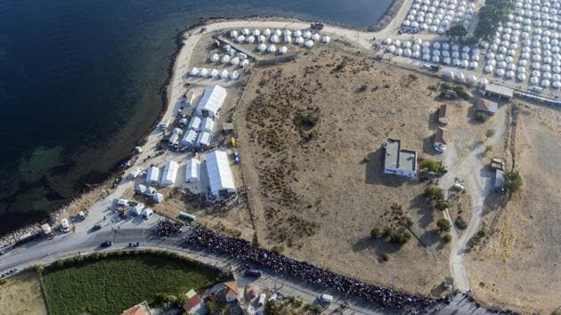 An aerial view showing the temporary camp in Kara Tepe on the island of Lesbos on September 18. The United Nations High Commissioner for Refugees (UNHCR)on September 18 warned Greece that the new camp can only be temporary. “UNHCR supports its use as temporary solution but cautions that what may be deemed adequate in terms of shelter and services during emergency situations is not appropriate for the longer-term,” spokesperson Shabia Mantoo said in a public address. (AP) An aerial view showing the temporary camp in Kara Tepe on the island of Lesbos on September 18. The United Nations High Commissioner for Refugees (UNHCR)on September 18 warned Greece that the new camp can only be temporary. “UNHCR supports its use as temporary solution but cautions that what may be deemed adequate in terms of shelter and services during emergency situations is not appropriate for the longer-term,” spokesperson Shabia Mantoo said in a public address. (AP)