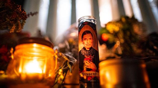 A candle sits outside the US Supreme Court following the death of Ginsburg in Washington on September 19. Late in her court tenure, she became a social media icon, the Notorious RBG, a name coined by a law student who admired Ginsburg’s dissent in a case cutting back on a key civil rights law. (Al Drago / REUTERS) 