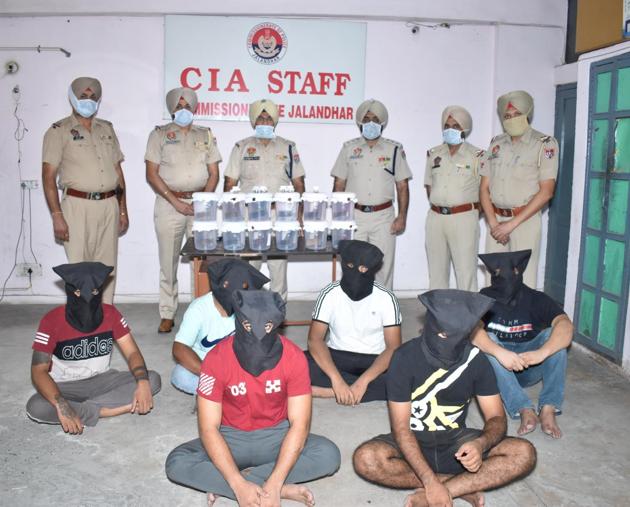 The Jalandhar commissionerate police team with six men arrested in connection with an arms racket. (HT Photo)